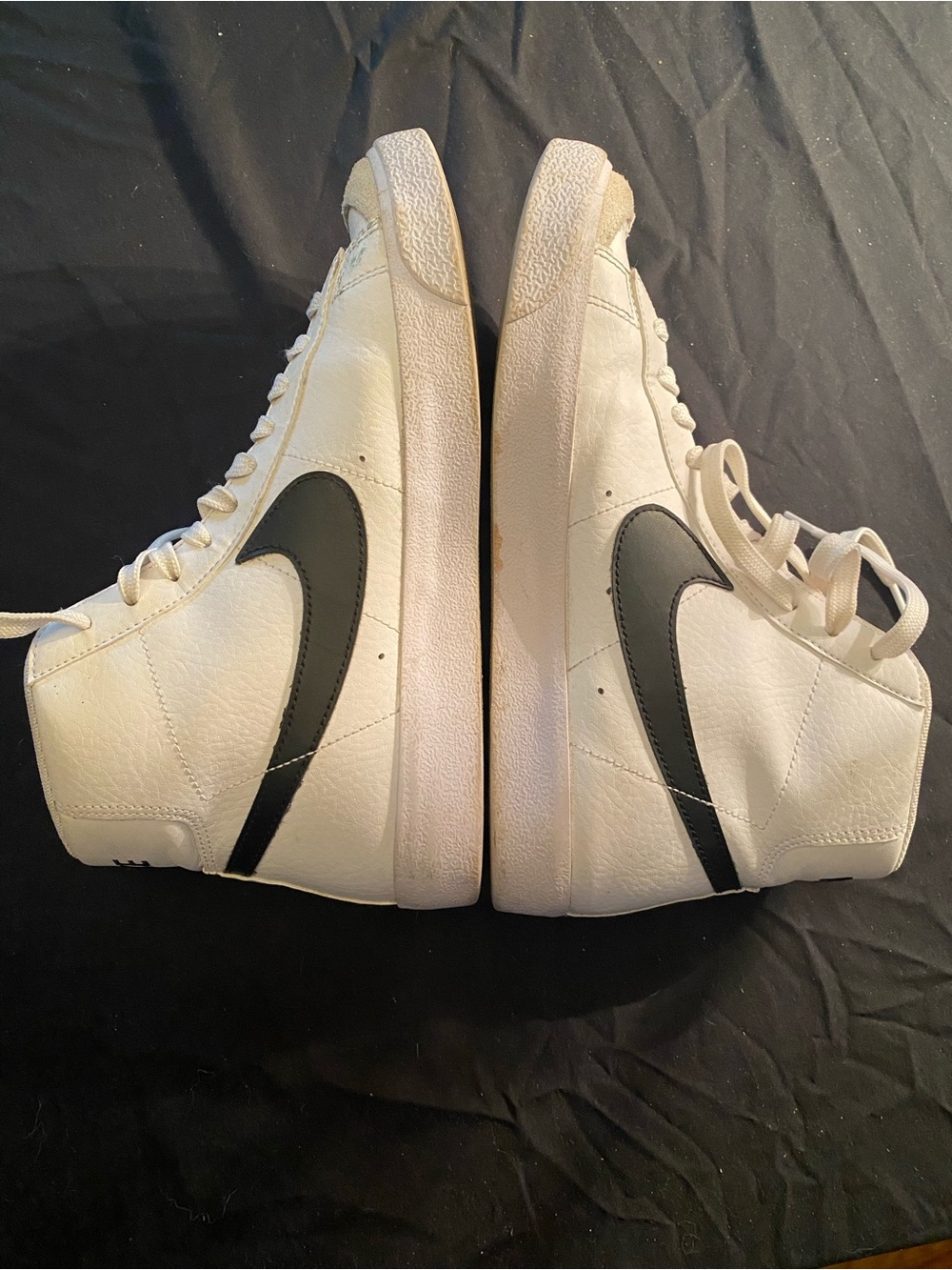 Nike White High-Top Sneakers with Black Swoosh